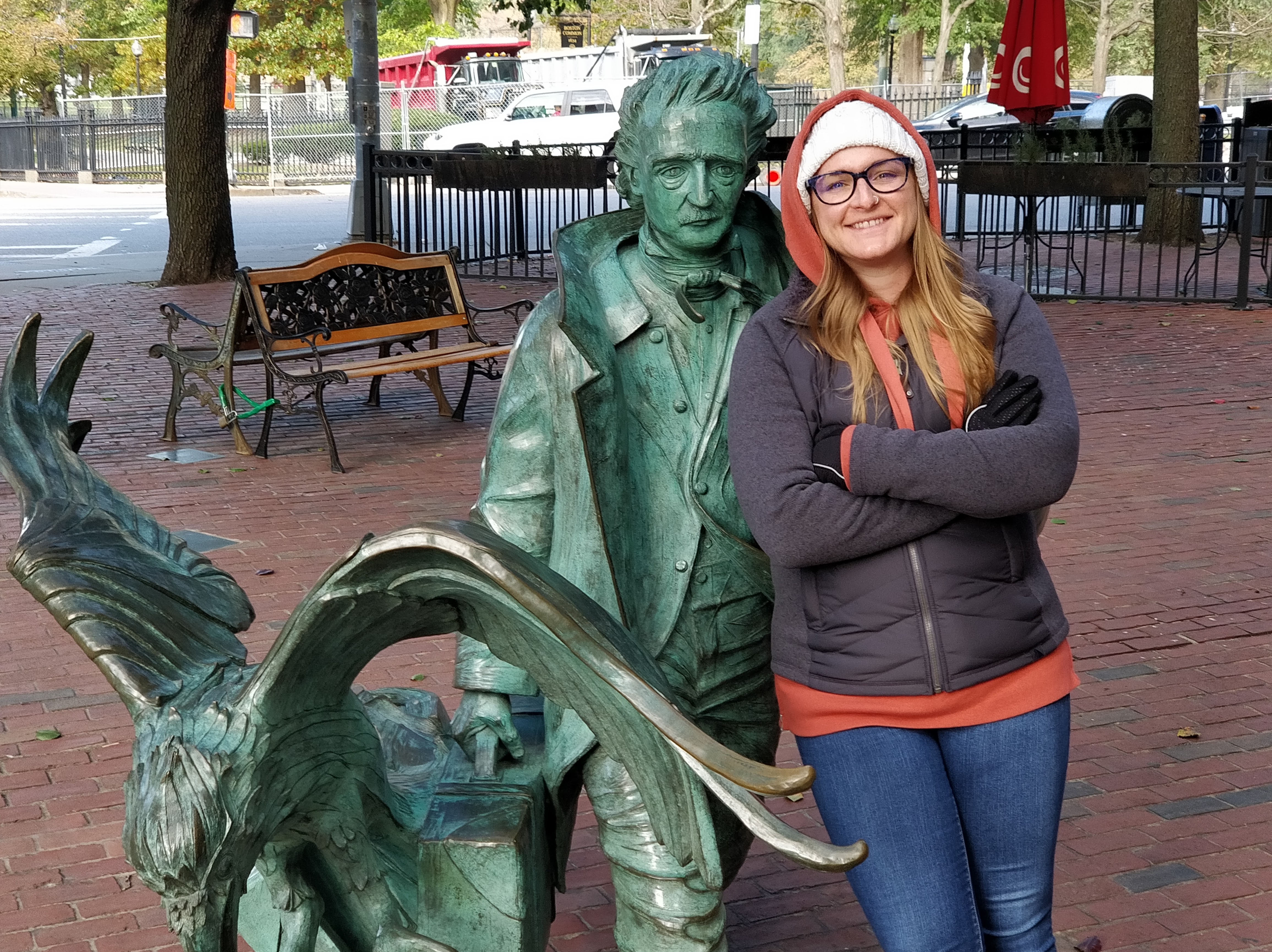 Kelly Loftis with outdoor statue of Edgar Allen Poe
