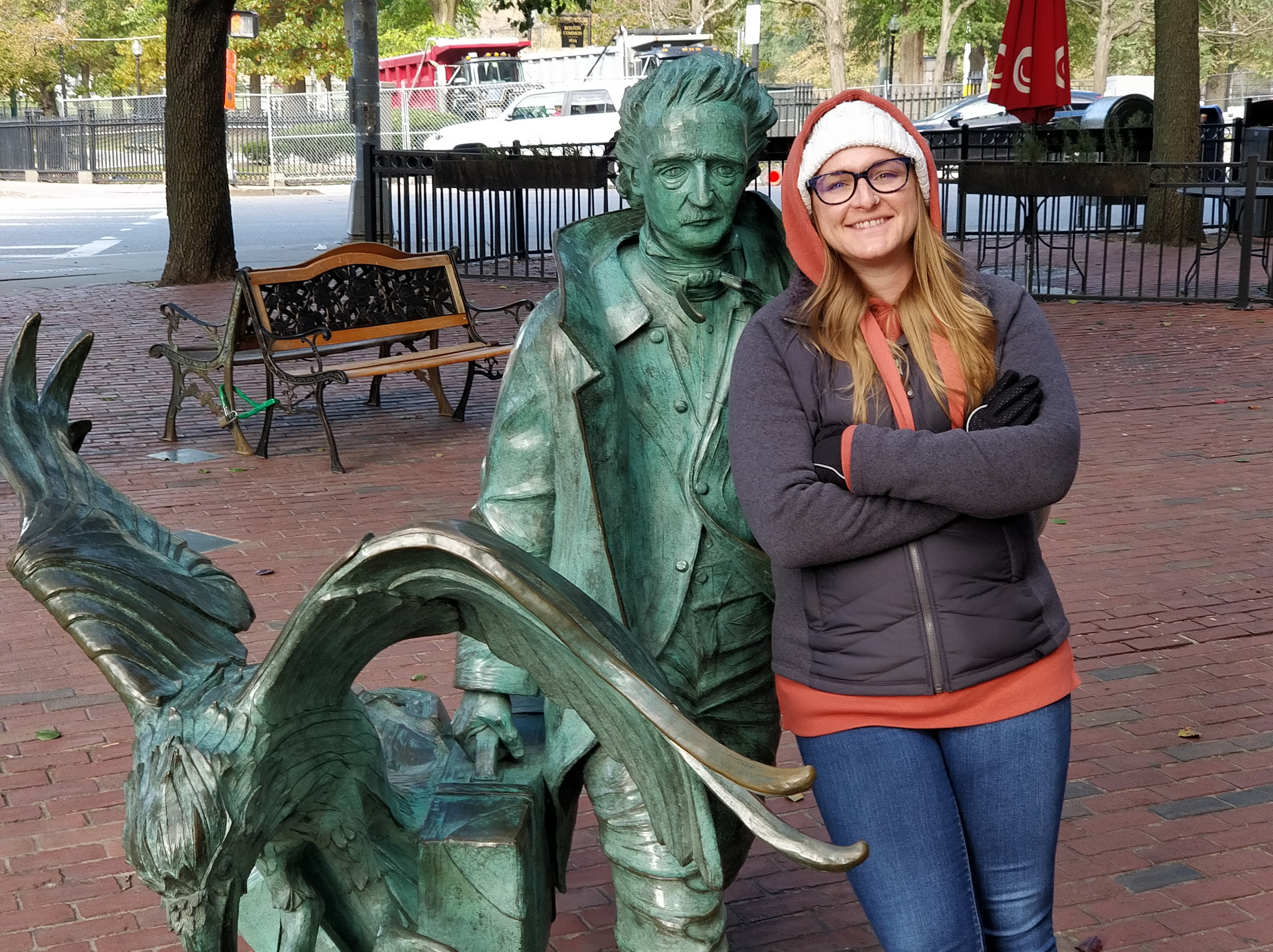 Kelly R. Loftis, LMFT Kelly Loftis with outdoor statue of Edgar Allen Poe